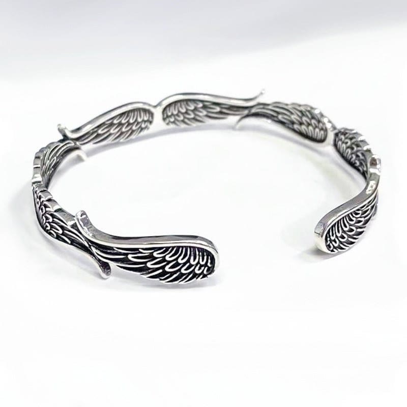 Brazalete de la suerte tallado con alas de ángel y plumas de Buda