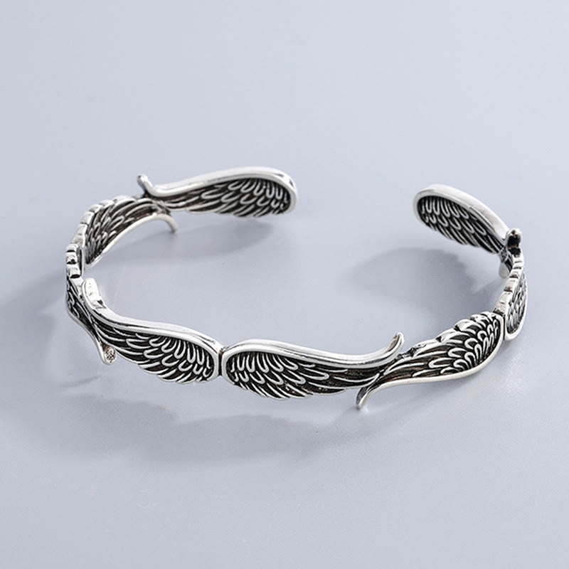 Brazalete de la suerte tallado con alas de ángel y plumas de Buda