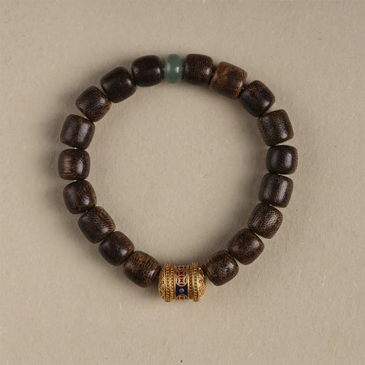 Pulsera de piedra de Buda con moneda de cobre y madera de agar que crea una nube auspiciosa y calmada