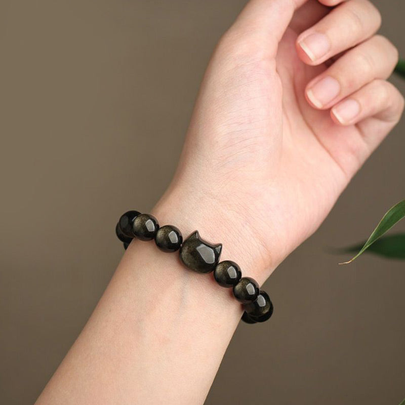Pulsera de protección con piedras de Buda, obsidiana dorada y obsidiana plateada con brillo, con forma de pata de gato de la suerte.
