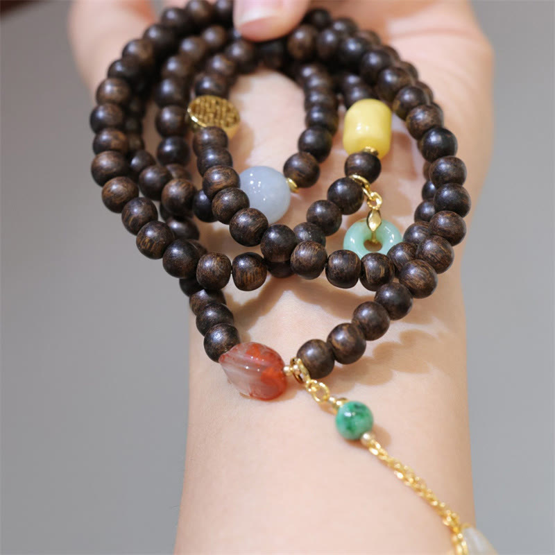 Pulsera de la paz con 108 cuentas de mala de Buda, madera de agar de Brunei, ámbar, ágata roja y jade con hebilla de la paz.