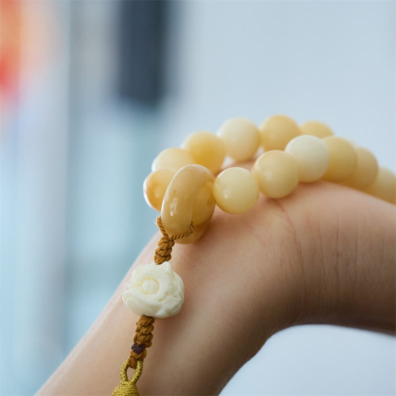 Mala de muñeca con borla de armonía y amuleto de león danzante de marfil con semillas de bodhi naturales de Buda