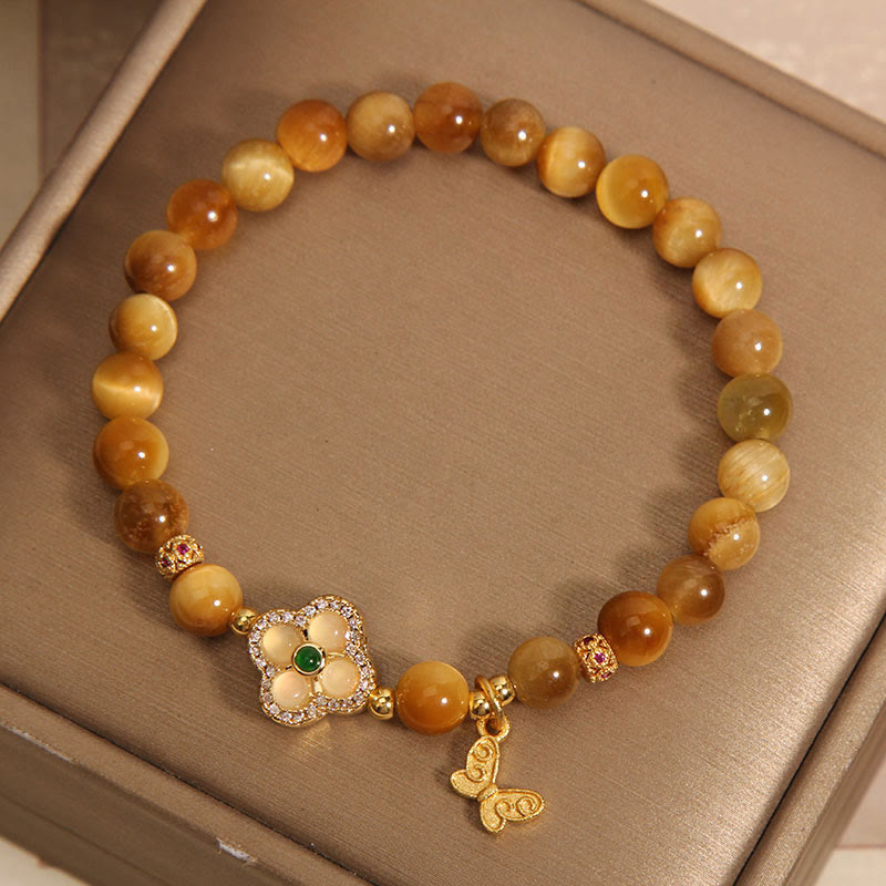 Pulsera de protección con mariposa, trébol de cuatro hojas y ojo de tigre de Buddha Stones