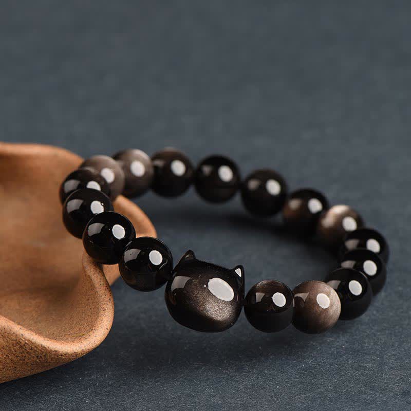 Pulsera de protección con piedras de Buda, obsidiana dorada y obsidiana plateada con brillo, con forma de pata de gato de la suerte.