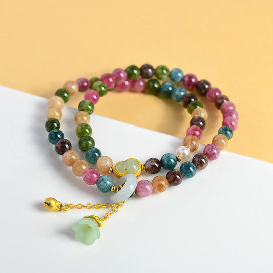 Pulsera con dijes de calabaza de turmalina multicolor y lirio de los valles de doble vuelta con piedras de Buda