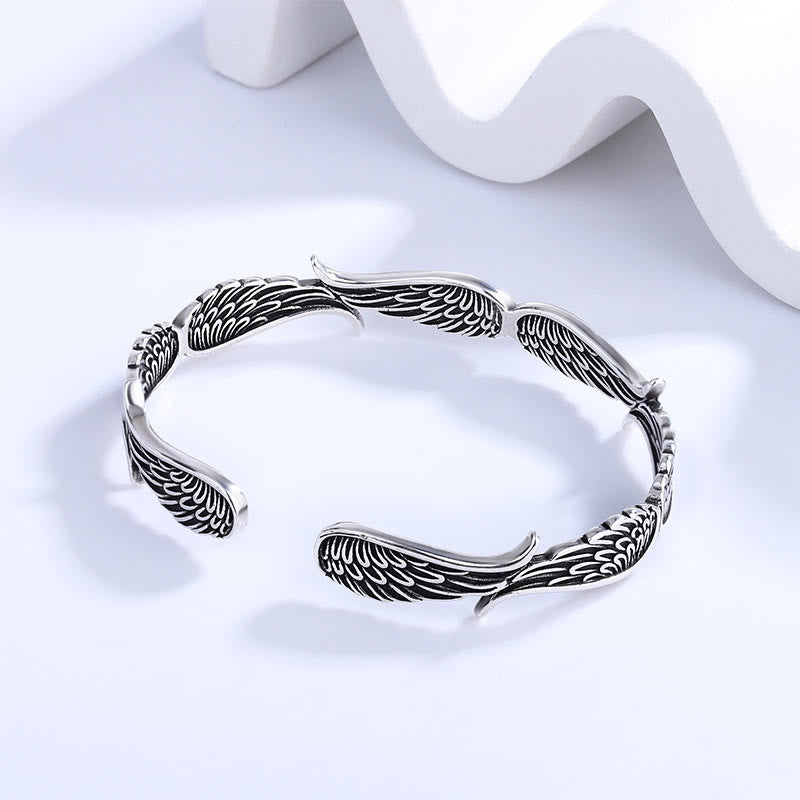 Brazalete de la suerte tallado con alas de ángel y plumas de Buda