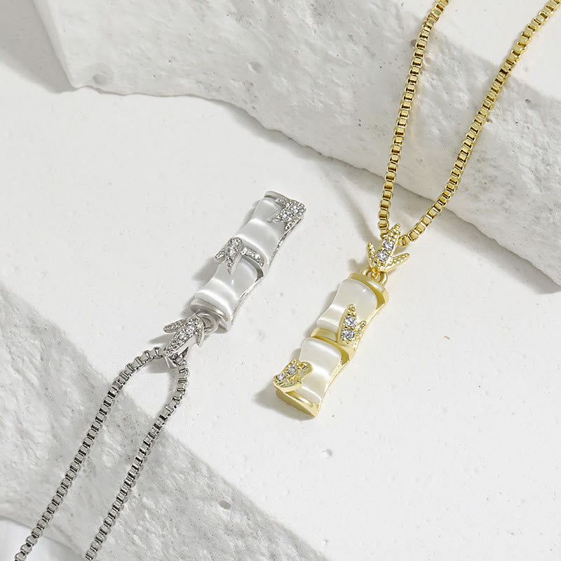 Collar con colgante de armonía con diseño de bambú y calcedonia de piedras de Buda