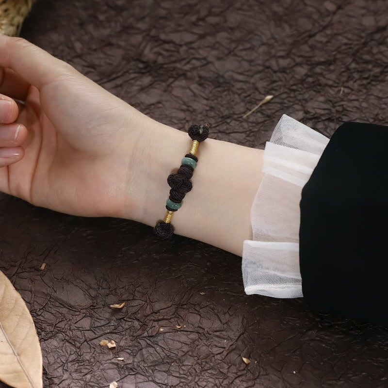 Pulsera trenzada con nudo de la fortuna y jade rojo de Buda