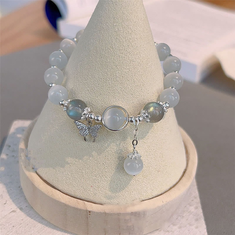 Pulsera de soporte con dije de estrella y mariposa con piedra lunar y ojo de gato de Buddha Stones