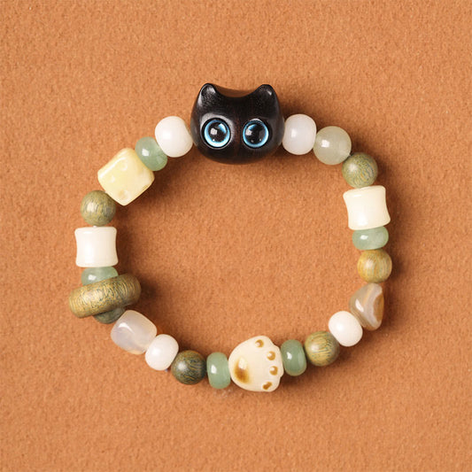 Pulsera de la paz con piedras de Buda, semillas de Bodhi, sándalo verde, madera de ébano, hoja pequeña, sándalo rojo, cabeza de gato y garra.