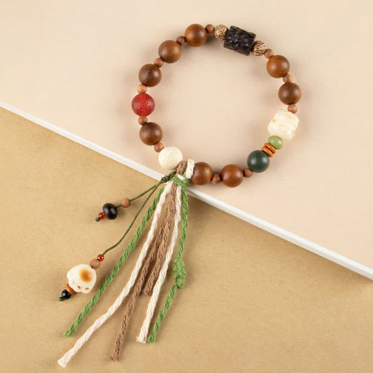 Pulsera con borlas de protección de la auspiciosidad, con piedras de Buda, rayo, madera, semilla de Bodhi y garra de gato