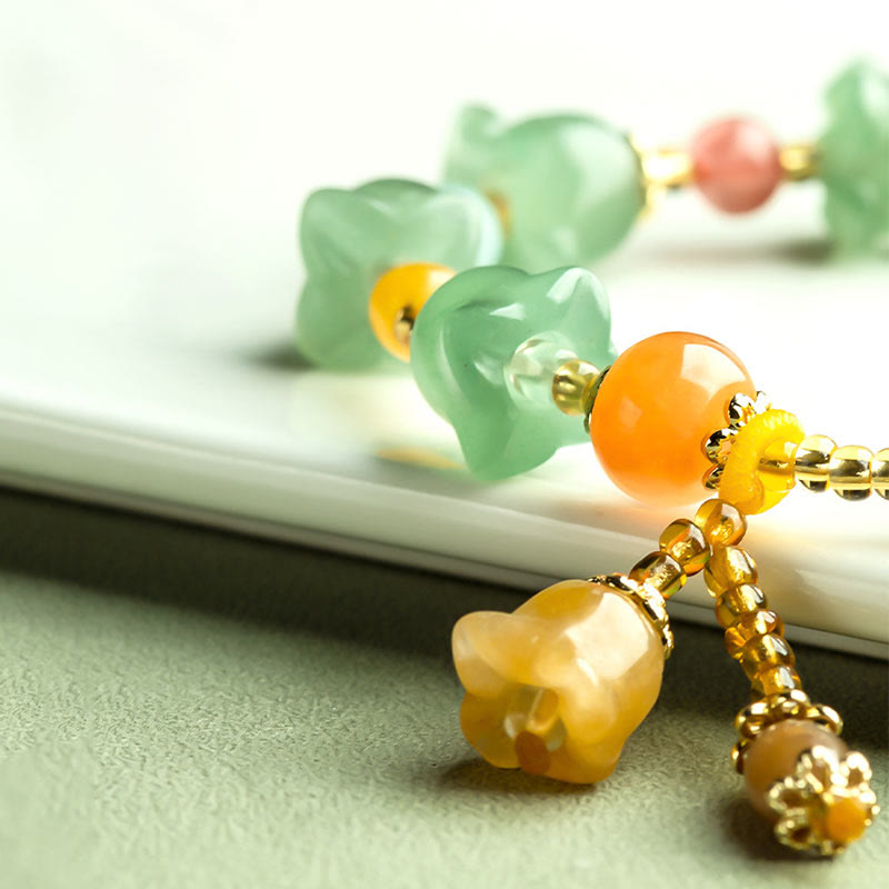 Pulsera de la suerte con flor de magnolia y aventurina verde de Buddha Stones