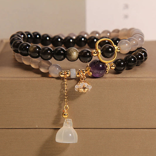 Pulsera de doble vuelta reforzada con dije de loto, obsidiana, ágata gris y brillo dorado de Buddha Stones