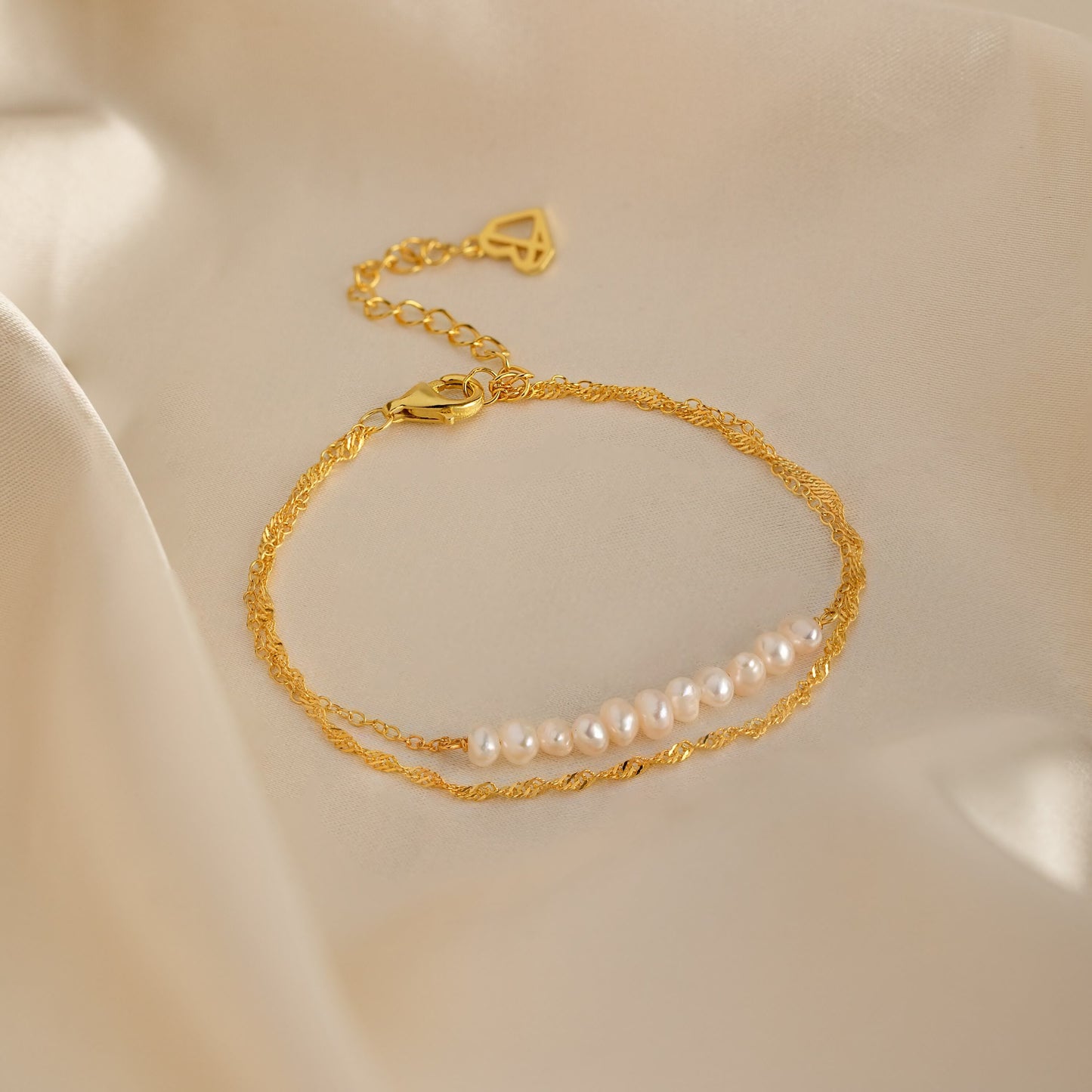 Pulsera trenzada de dos perlas