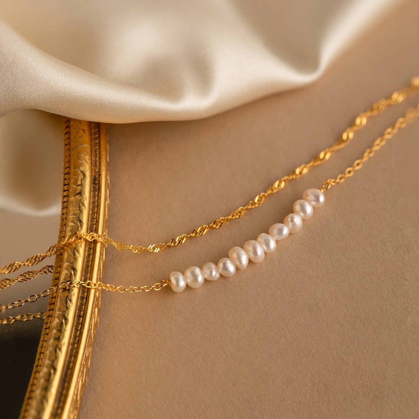Pulsera trenzada de dos perlas