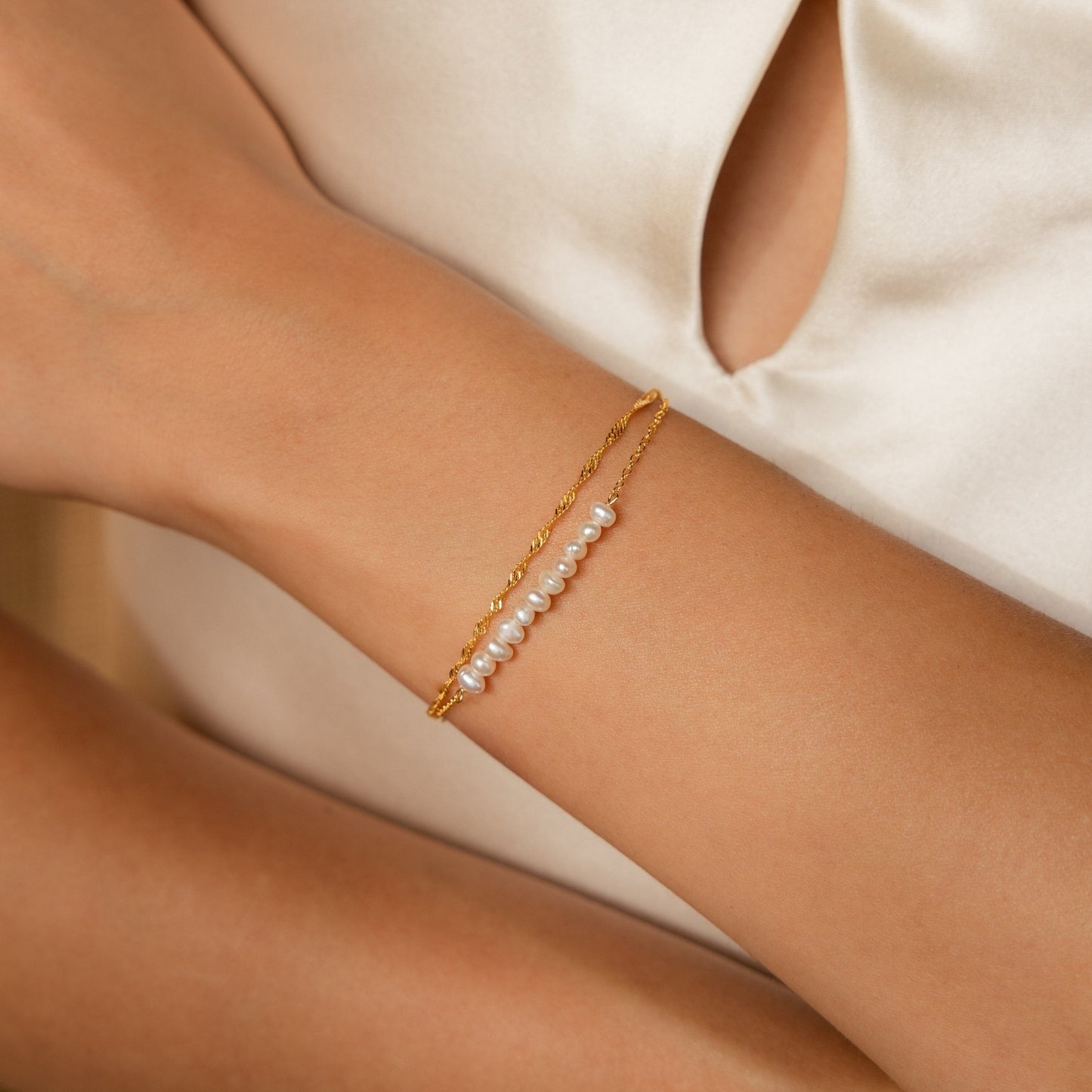 Pulsera trenzada de dos perlas