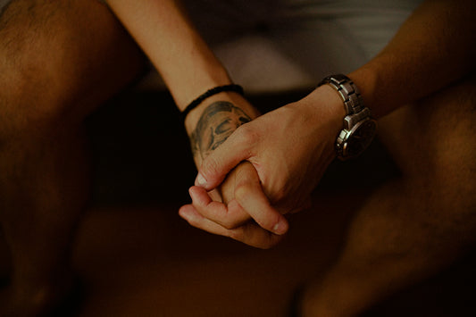 person wearing silver link bracelet watch