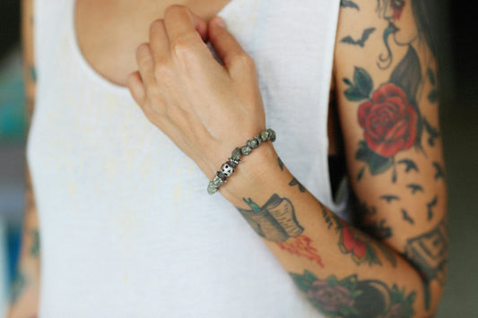 a woman with a tattoo on her arm