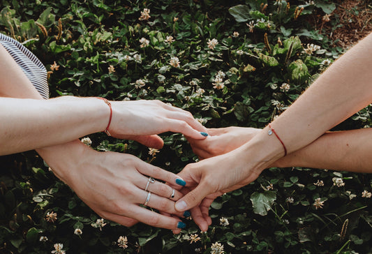a group of people holding hands