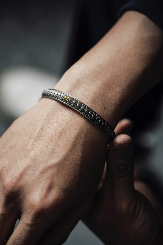 a close up of a person wearing a bracelet