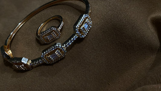 a couple of bracelets sitting on top of a brown cloth