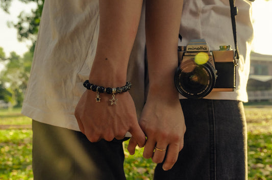 a man and a woman holding hands with a camera