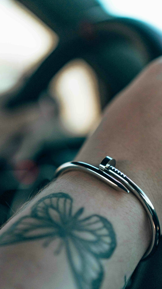 a close up of a person's arm with a tattoo on it