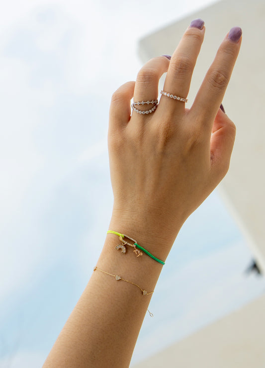 A woman's hand holding up a peace sign