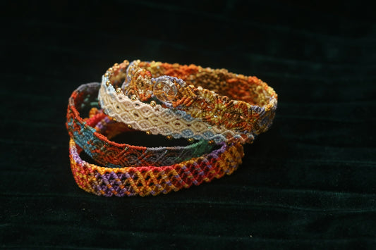 Three colorful woven bracelets stacked together