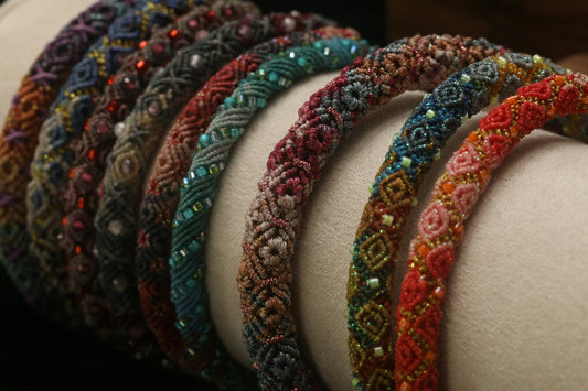 Colorful woven bracelets arranged in a row