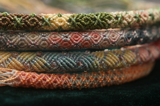 Stack of colorful woven friendship bracelets
