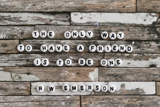 Quote about friendship by r w emerson on rustic wood.