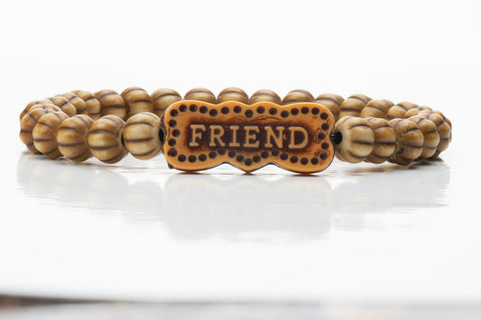 Beaded bracelet with friend charm