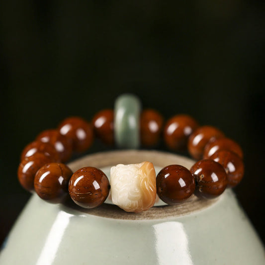 Pulsera de la sabiduría del león danzante con semillas de bodhi moradas y piedras de Buda