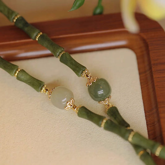Pulsera de la suerte con diseño de bambú y peridoto de jade hetiano bañada en cobre de 14 quilates con piedras de Buda 