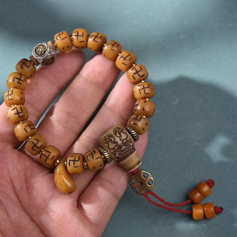 Buddha-Steine, natürliches tibetisches Kamelknochen-Hakenkreuz-Dzi-Perlen-Shankha-Buddha-Charm, Kirtimukha-Glücksschutz-Quastenarmband