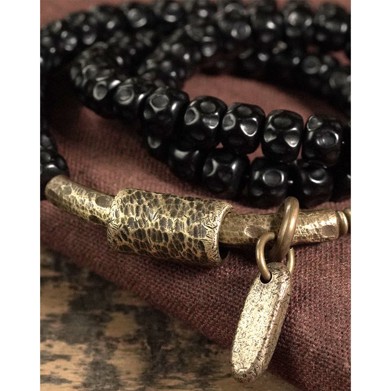 Pulsera de triple vuelta de cobre con cáscara de coco retro de Buddha Stones 