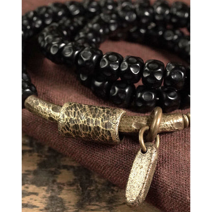 Pulsera de triple vuelta de cobre con cáscara de coco retro de Buddha Stones 