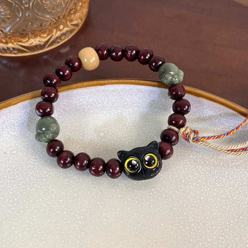Pulsera de madera con borlas de la paz, con piedras de Buda, madera de ébano y pata de jade de gato encantador 
