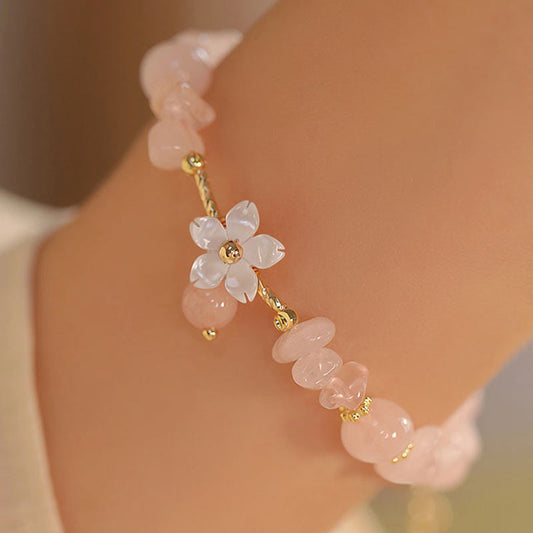 Pulsera de amor con flores de cristal rosa natural bañada en oro de 14 quilates de Buddha Stones 