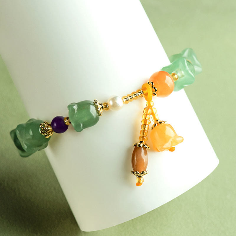 Pulsera de la suerte con flor de magnolia y aventurina verde de Buddha Stones 