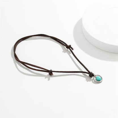 Collar con colgante de piedra turquesa redonda de Buda y fuerza protectora