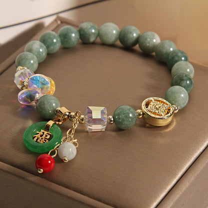 Pulsera curativa con dijes de jade fu y cuarzo fresa de Buda