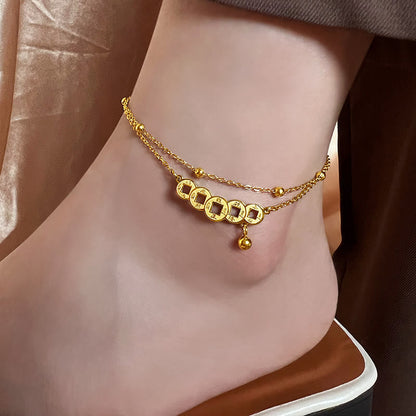 Tobillera de acero y titanio con monedas de cobre y piedras de Buda que atraen la riqueza