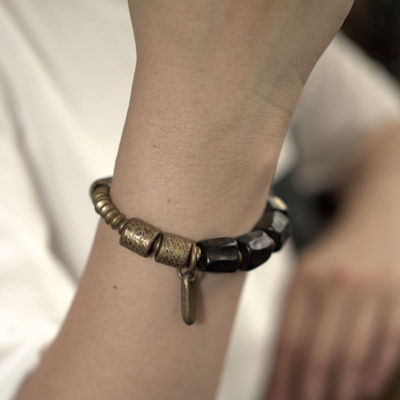 Pulsera de cuentas de cobre y madera de ébano con piedras de Buda de la paz vintage 