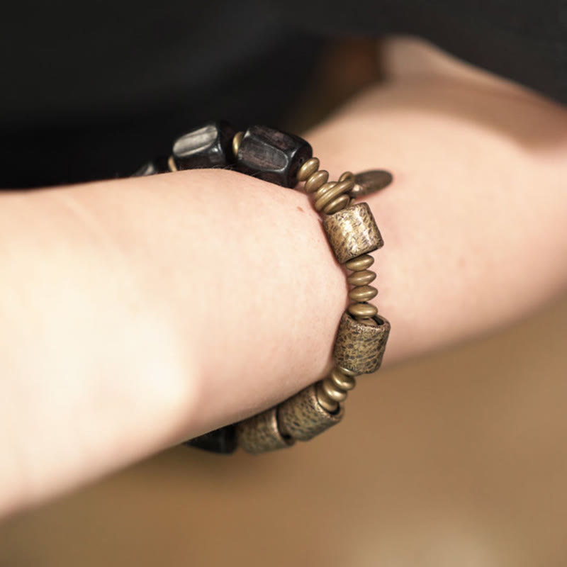 Pulsera de cuentas de cobre y madera de ébano con piedras de Buda de la paz vintage 