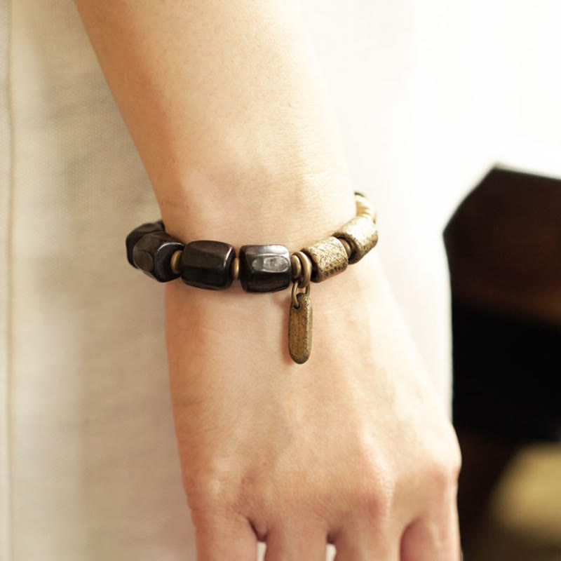 Pulsera de cuentas de cobre y madera de ébano con piedras de Buda de la paz vintage 
