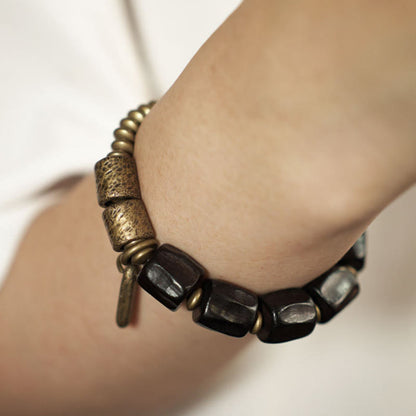 Pulsera de cuentas de cobre y madera de ébano con piedras de Buda de la paz vintage 