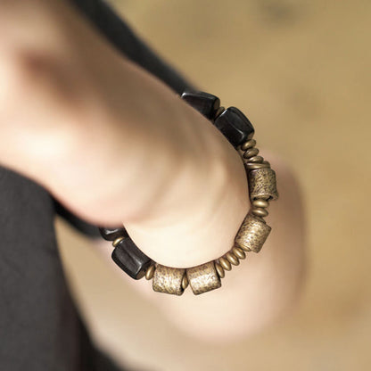 Pulsera de cuentas de cobre y madera de ébano con piedras de Buda de la paz vintage 