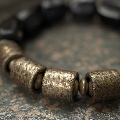Pulsera de cuentas de cobre y madera de ébano con piedras de Buda de la paz vintage 